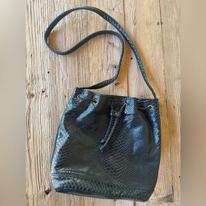 1980s bucket bag textured like alligator retro , edgy style
